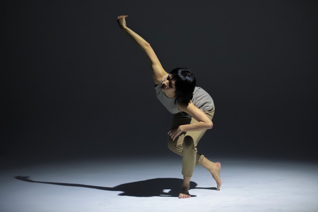 a woman standing on one leg in a pose